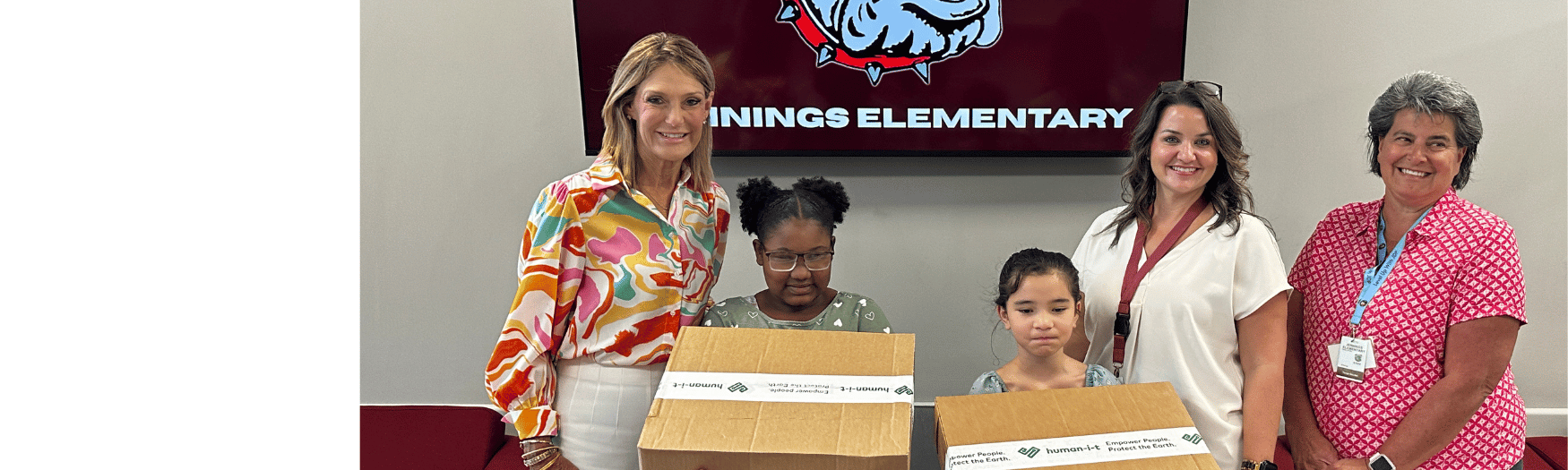 2 children with new laptops