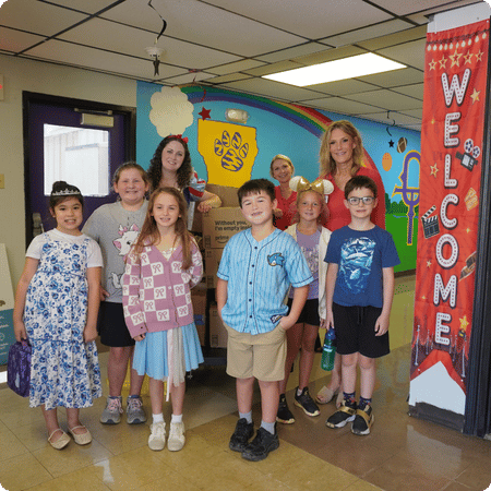 children with school supplies