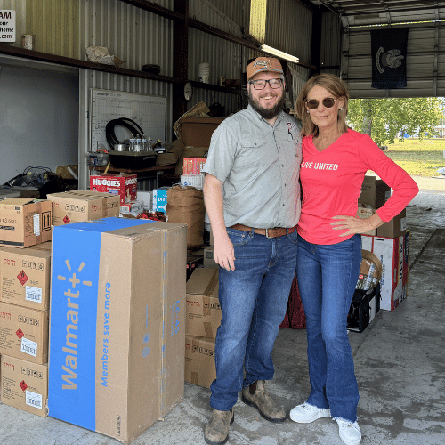 2 people with hurricane supplies